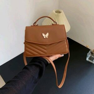 Square one-shoulder flap crossbody bag with bow and simple solid color stitching