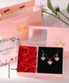 Heart-shaped necklace and earrings with rose in a box