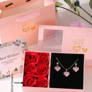 Heart-shaped necklace and earrings with rose in a box