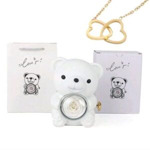 Rotating bear jewelry box set featuring a preserved rose and a heart-shaped necklace.