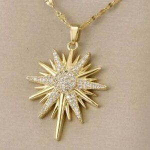 “Star of Bethlehem” pendant necklace featuring a star-shaped charm adorned with white zircons