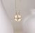 Gold-Plated Four Leaf Clover Pendant With Cubic Zirconia Inlaid Heart Mosaic